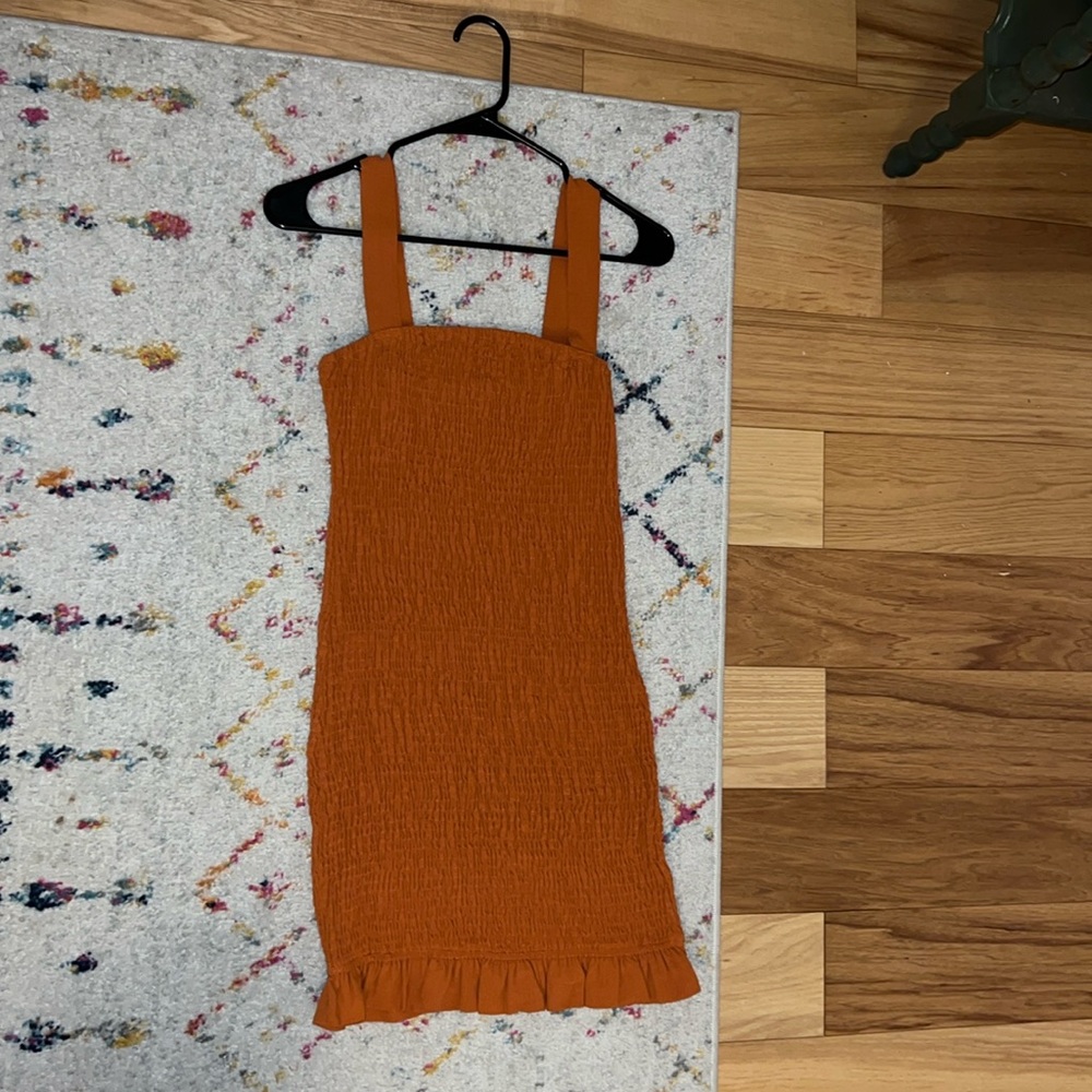 Orange shirred bodycon dress